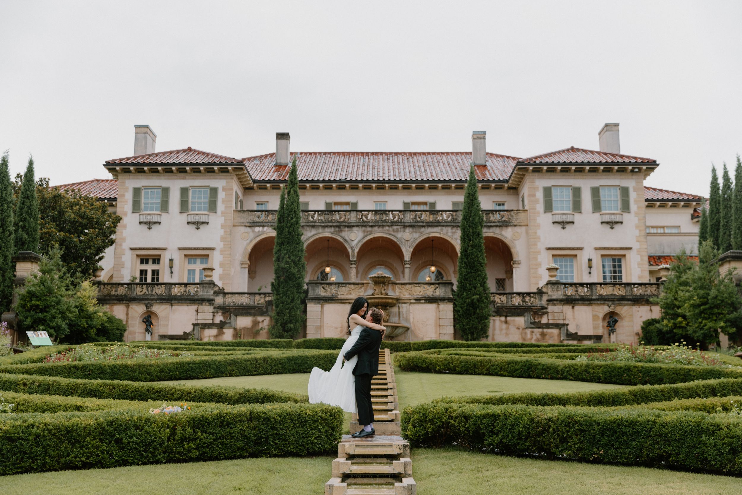 A majestic Mediterranean-style estate with stone architecture and landscaped gardens viewed from multiple angles.