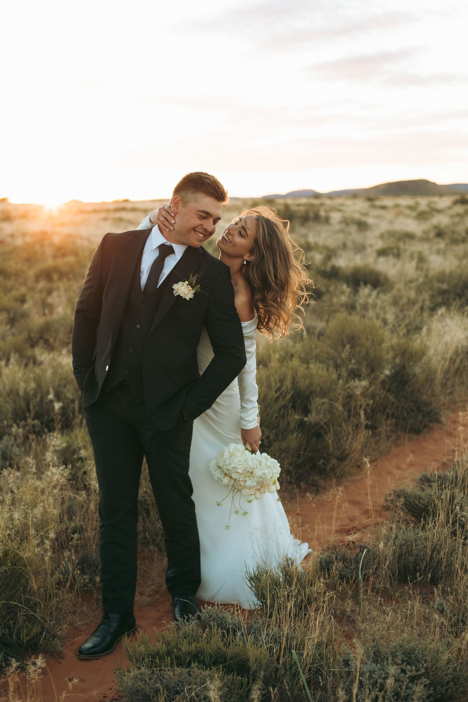 Romantic wedding portrait of a newly married couple surrounded by the natural beauty of the Karoo in South Africa.