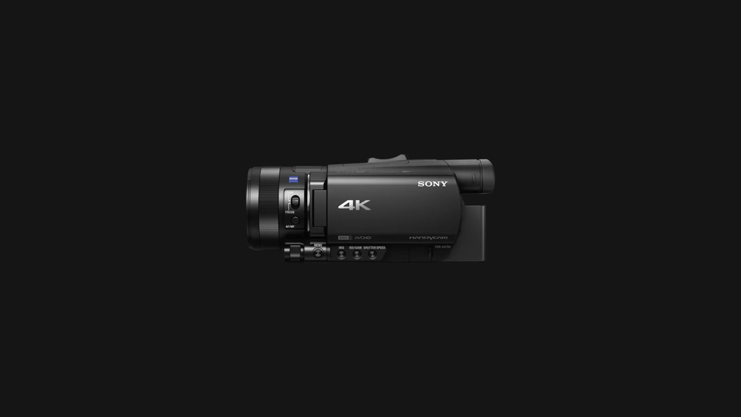 Five different black video cameras or camcorders displayed in a row against a dark background.
