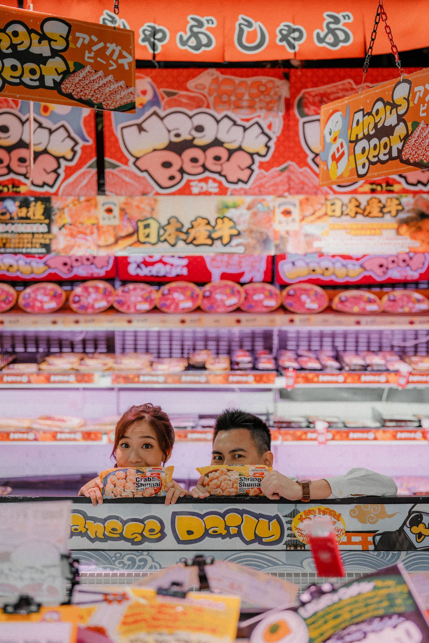 Bright Japanese snack display at an Asian grocery store with colorful packaging and signage.