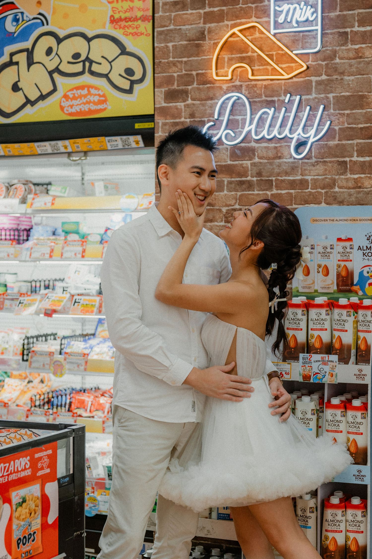 Playful wedding photography sequence against brick wall and store shelves.