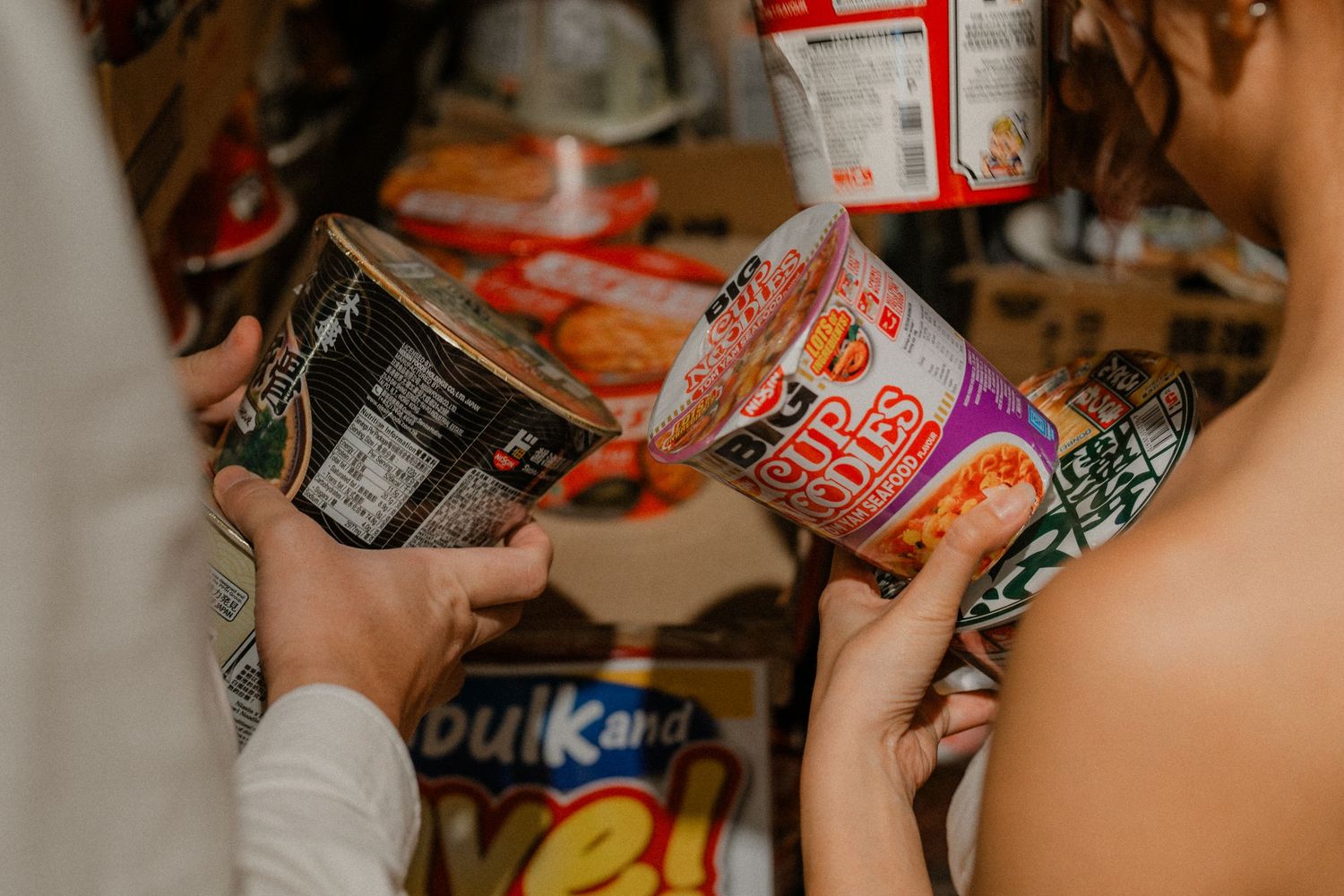 Close-up shot of shopping baskets during unique grocery store wedding photoshoot.