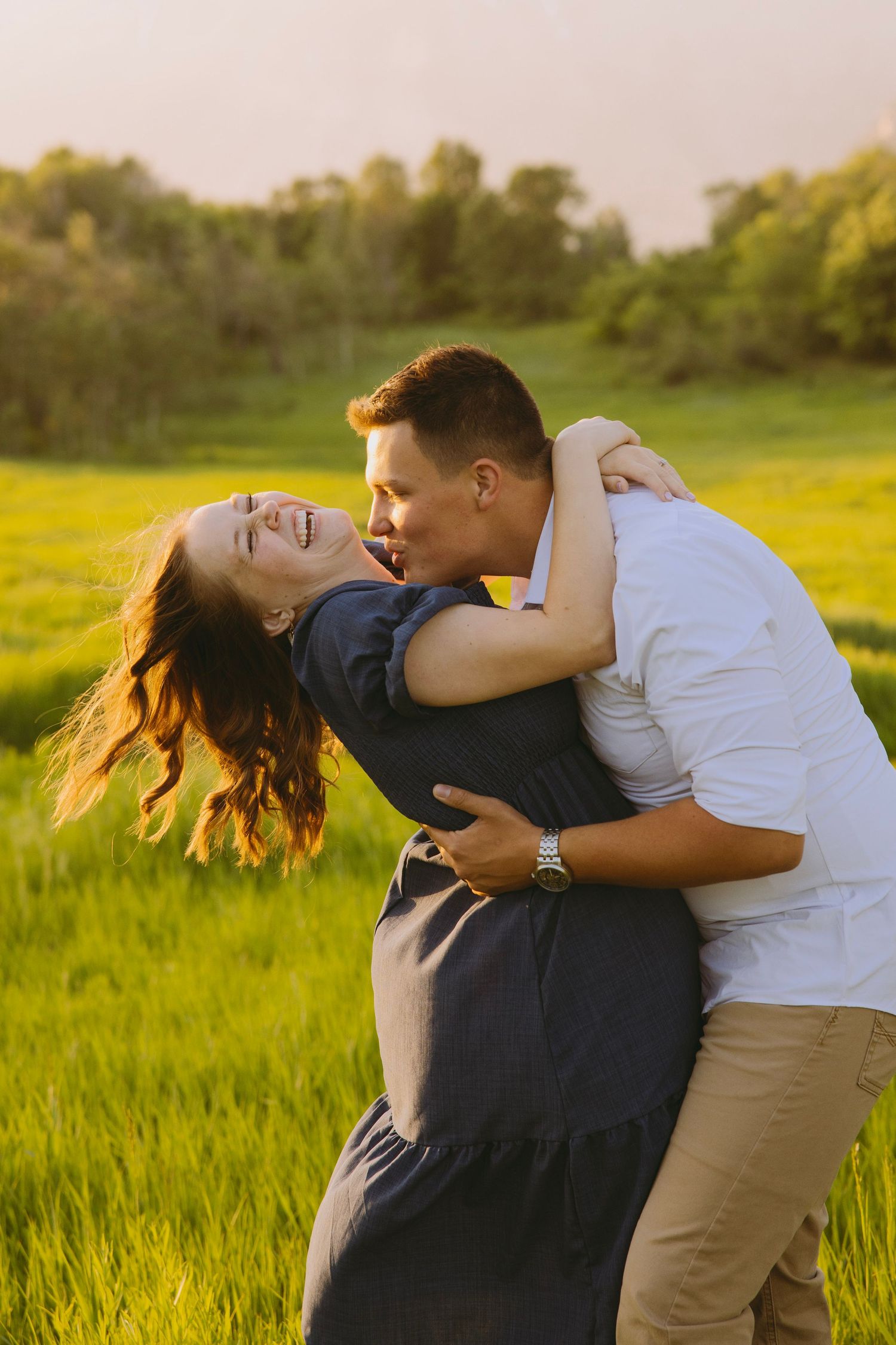 Hand placing white tissue paper into a decorative box to create elegant gift packaging presentation.