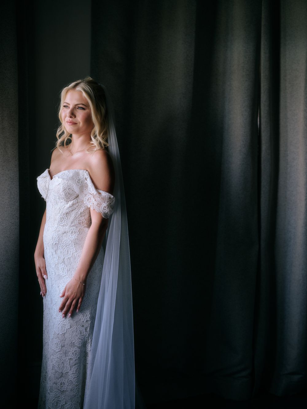 Artistic bridal portrait against dark background showcasing wedding dress details. Photoshoot by Venice Photographer Alina Indi