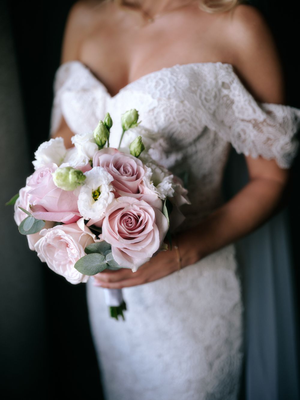 Close-up of pink roses and white flowers in a delicate bridal bouquet. Photoshoot by Venice Photographer Alina Indi