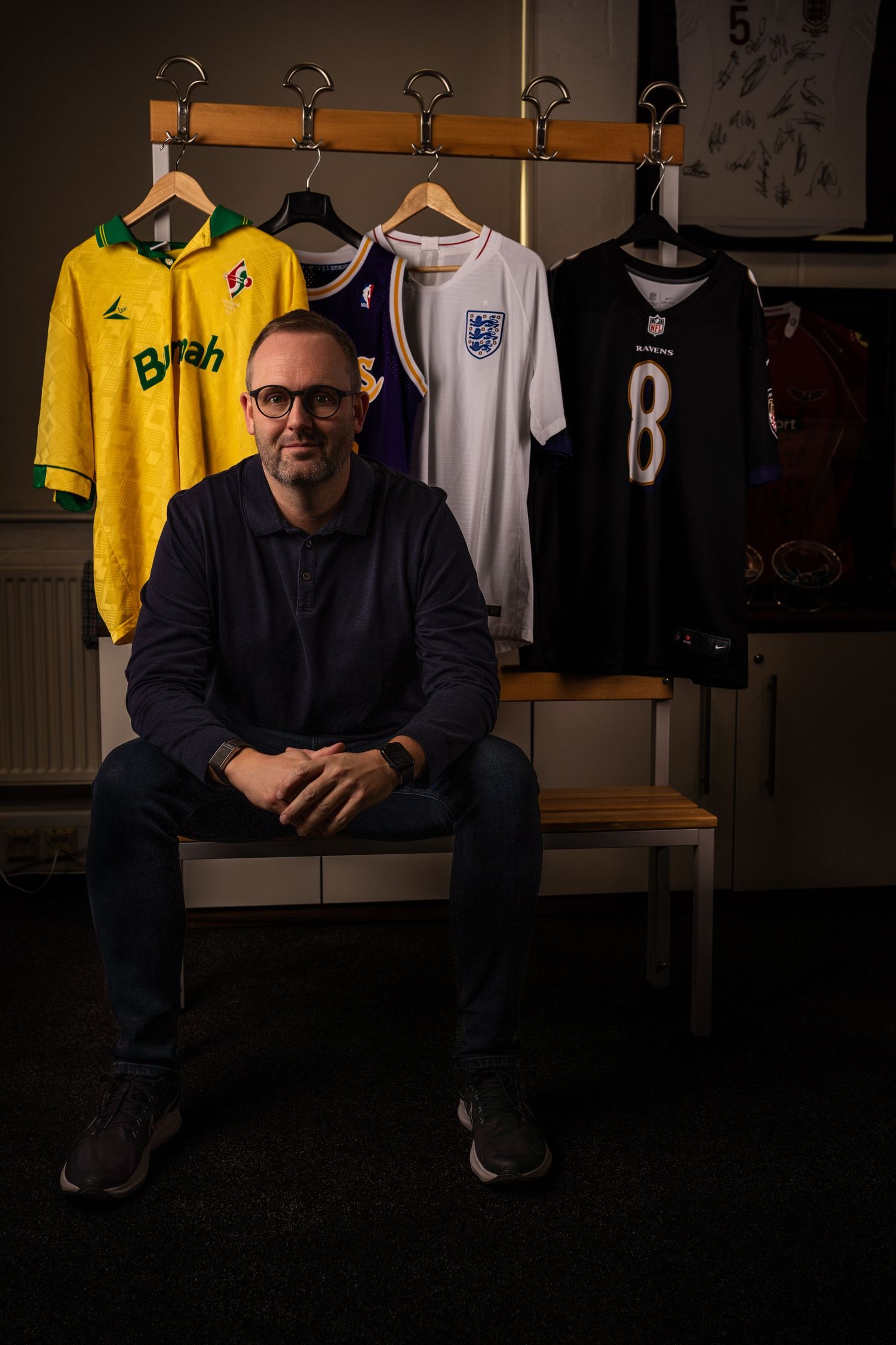 Portsmouth based business owner sits for a contemporary portrait during a business photography session.