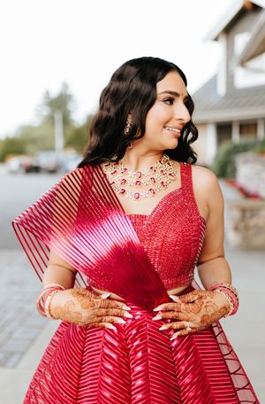 Close up portrait sequence of person in a vibrant red sequined dress showing details and textures of the garment.
