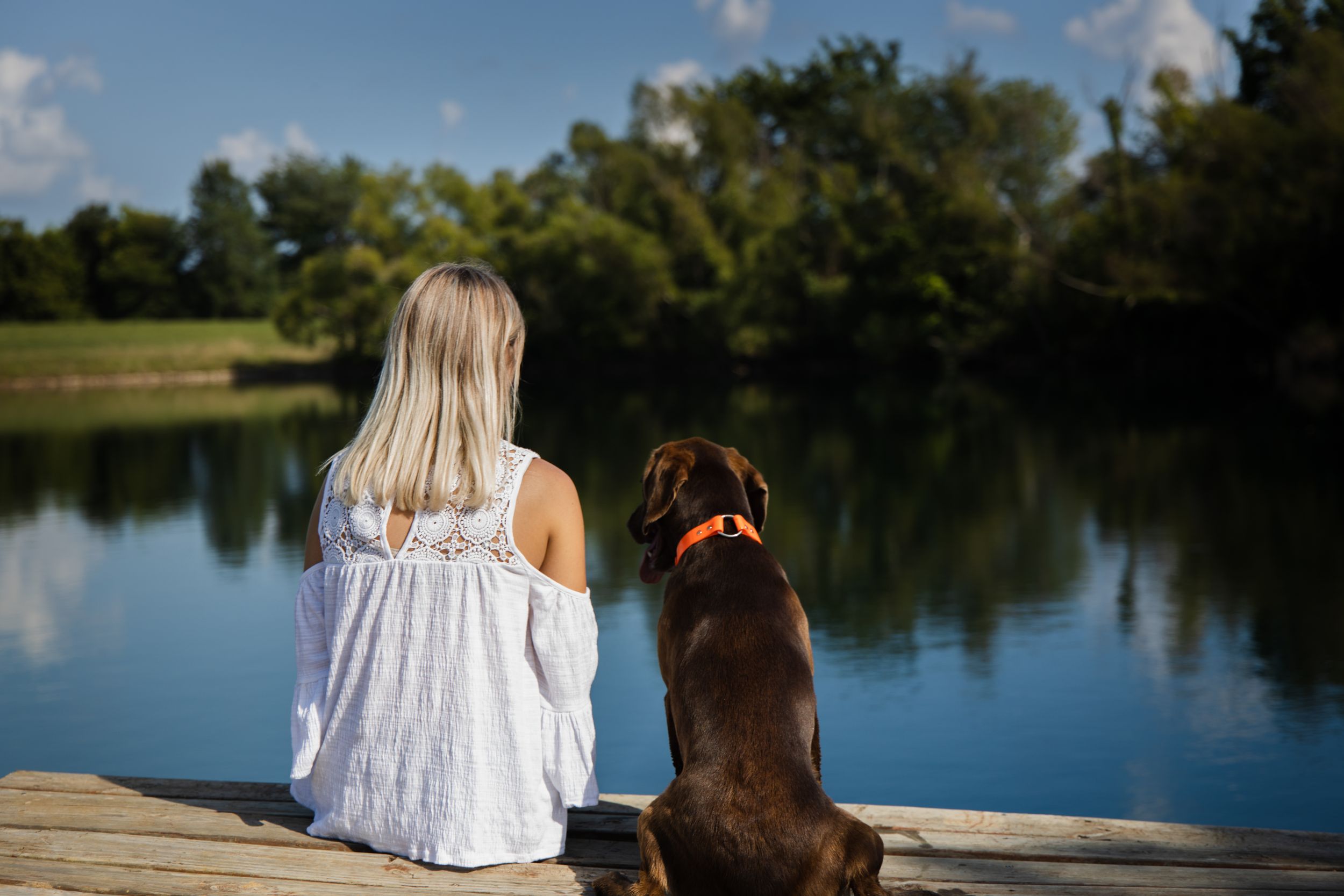 Portrait photo of a young woman and her dog