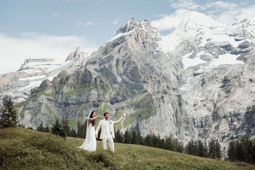 Misty mountain landscape with snow-capped peaks and rugged terrain in the Swiss Alps.