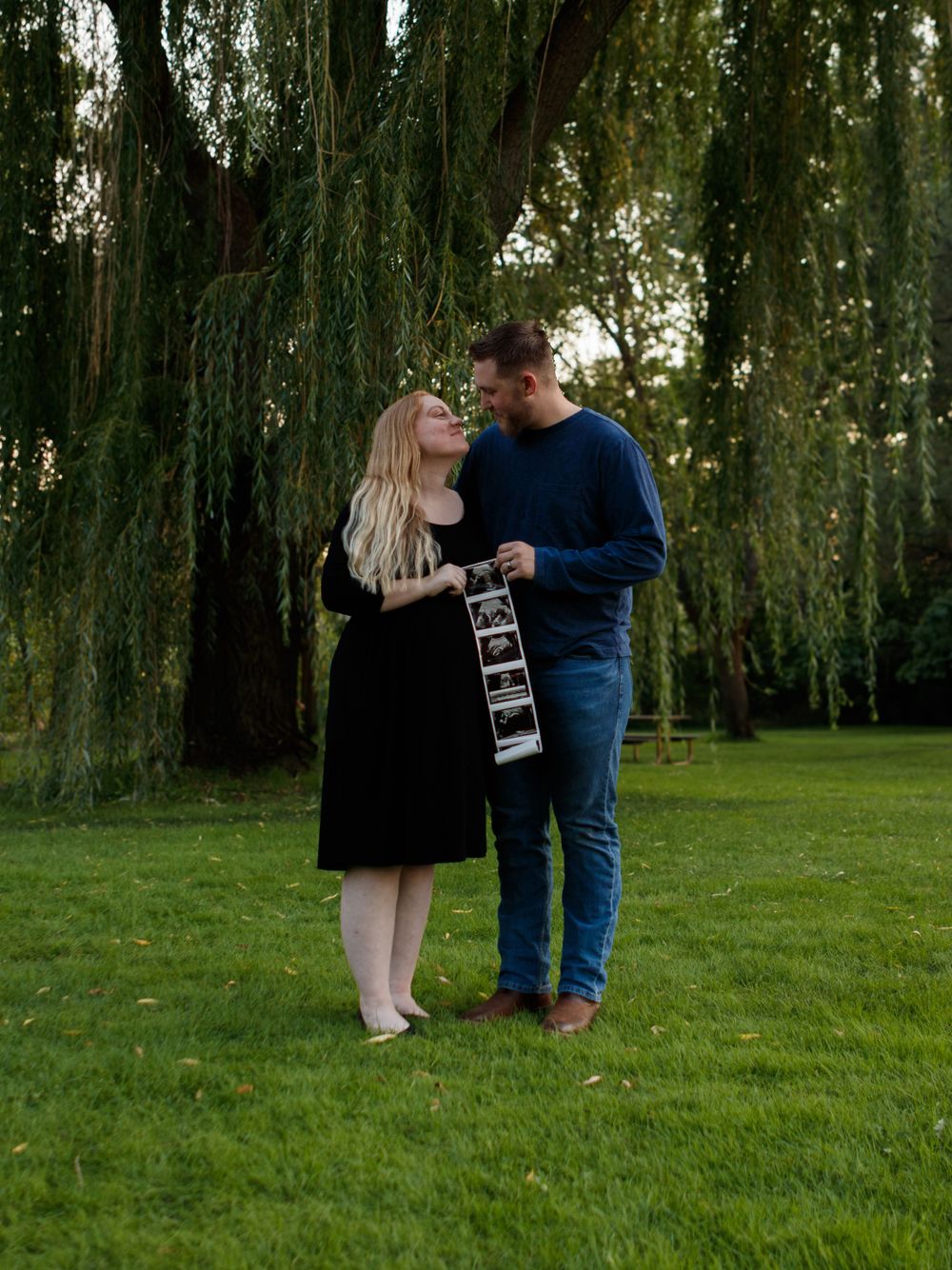 Maternity photo holding sonogram