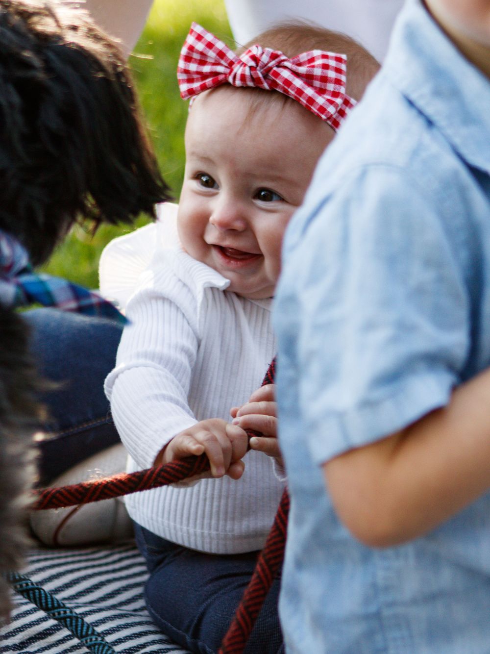 baby playing with puppy