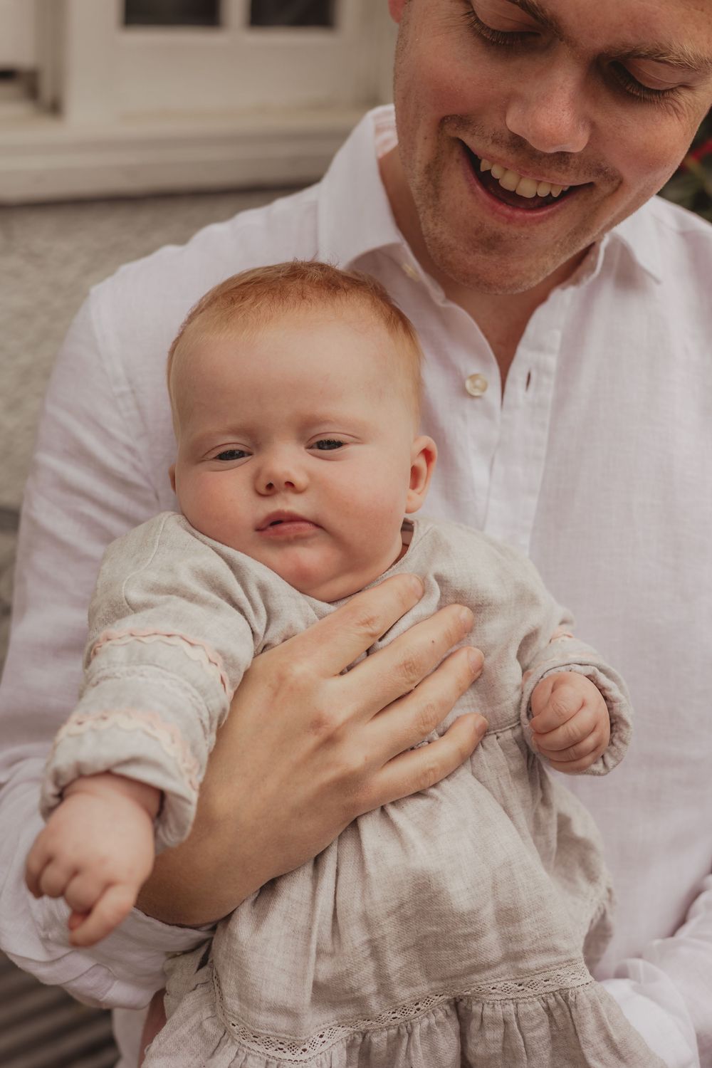 baby being held by dad