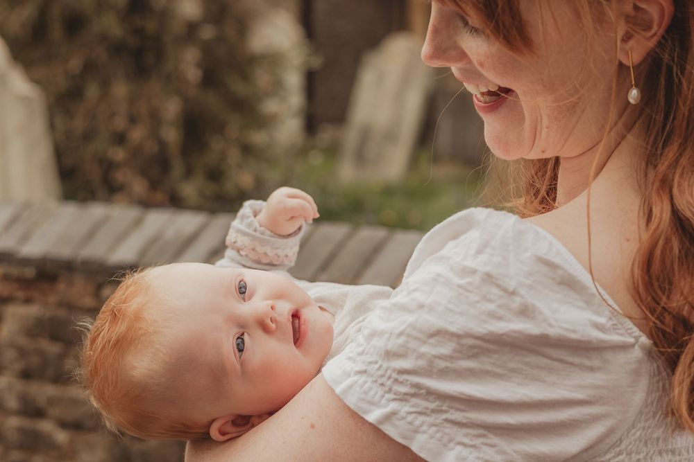 mum holding baby