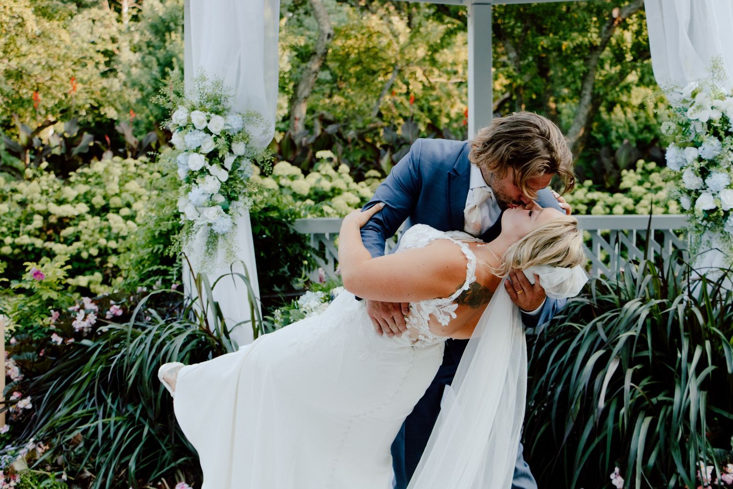 bride and groom dip kissing on their wedding day in northwest Indiana