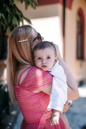 Series of tender moments captured between parent and child wearing pink and white clothing.