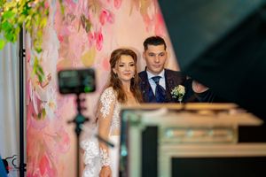 Dancing couples enjoying a romantic moment at an elegant wedding reception.