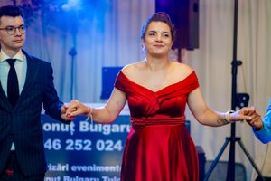 Elegant ballroom dance scene with dramatic lighting and formal evening wear.