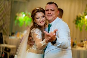 Wedding guests dancing together in pairs during a formal celebration.