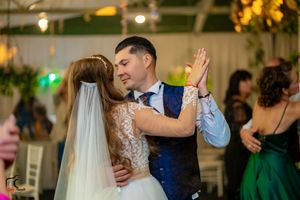 A couple sharing an intimate dance moment at their wedding reception.