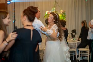 Wedding reception dance floor filled with couples enjoying the celebration.