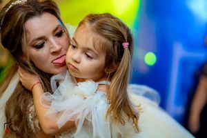 Wedding reception moment captured under dramatic yellow and blue lighting.