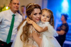 Wedding celebration with blue and green lighting effects creating a festive atmosphere.