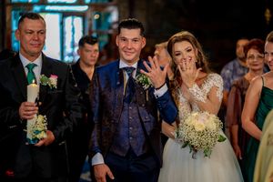 Wedding party and guests celebrating with joyful expressions.