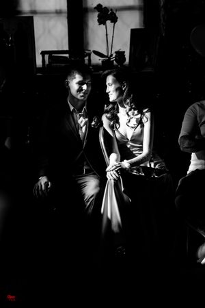 Dramatic black and white wedding photography captures intimate moments during an evening reception.