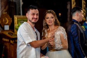 Newlyweds dancing and laughing together at their wedding reception.