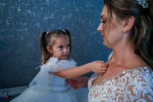 A touching portrait showing connection between family members against blue background.
