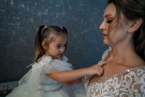 A candid family moment showing gentle interaction between parent and child.
