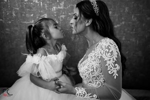 A monochrome capture of a heartwarming family moment against a textured background.