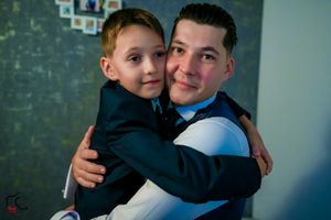 A warm hug captured during a special formal event preparation.