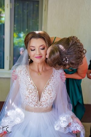 Wedding photography sequence showing affectionate moments in an indoor setting.