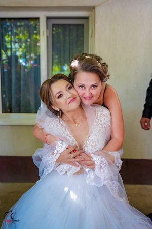 Wedding photography sequence showing intimate moments between two people in white dresses.