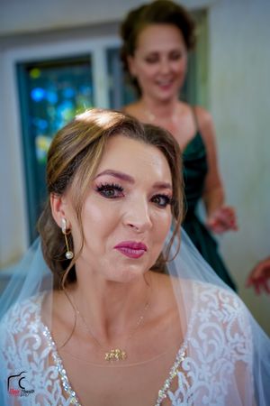 Candid shots of a bride in white lace dress displaying various happy expressions.