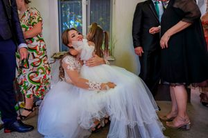 Intimate wedding celebration photos showing tender interactions between guests.