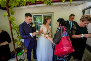 Candid moments from a wedding celebration showing guests interacting in a naturally lit venue.