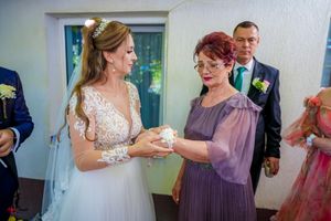 Series of candid wedding photos showing emotional interactions between guests and the bride.
