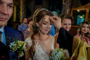Wedding party members during reception with elegant decor and mood lighting.