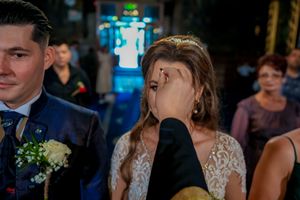 Wedding party members in formal attire gathered during an evening celebration.