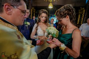 Wedding guests socializing during an evening reception with ambient lighting.