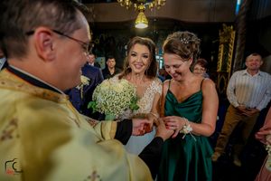 Wedding celebration showing guests in formal attire interacting at an evening event.