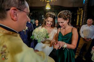 Wedding ceremony scene with traditional elements and elegant floral arrangements.