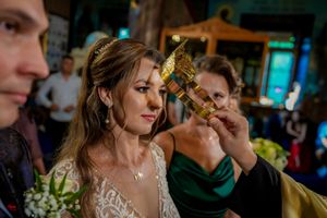 Orthodox wedding ceremony with traditional religious elements and golden accents.