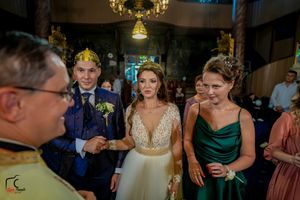 Wedding party members in coordinated attire during evening celebration.