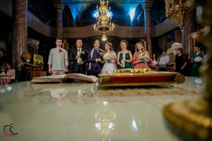 Elegant wedding venue with dramatic blue lighting and crystal chandeliers during evening reception.