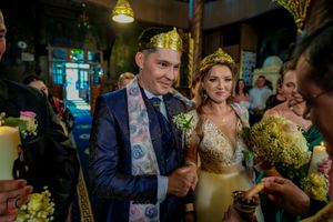 Orthodox Christian wedding ritual being performed with traditional ceremonial elements.