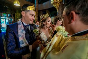 Traditional Orthodox wedding ritual being performed with clergy in gold vestments.