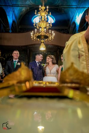 Chandelier-lit banquet hall with blue ambient lighting casting a romantic glow over the celebration.